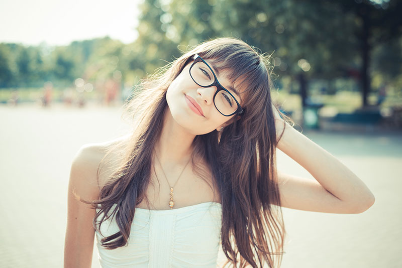 Young female outside wearing glasses